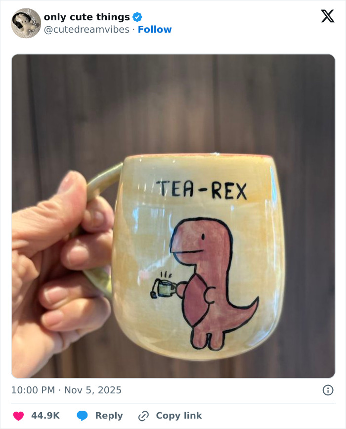 Hand holding mug with cartoon dinosaur and text tea-rex adorable posts