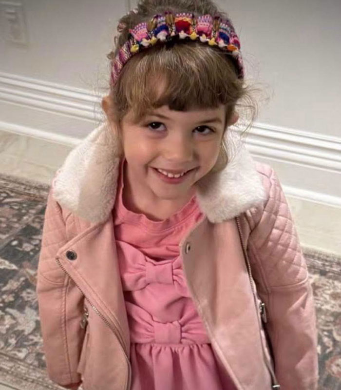 A young young girl in a pink coat, subject of a custody battle A young young girl in a pink coat, subject of a custody battle