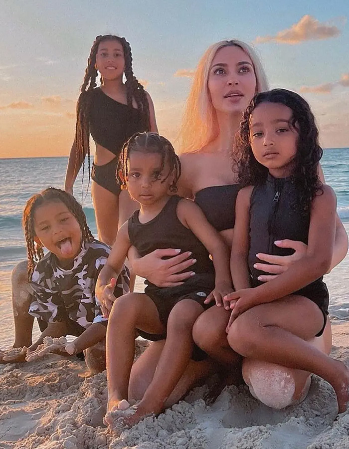 Kim Kardashian with her 4 kids on a beach setting Kim Kardashian with her 4 kids on a beach setting