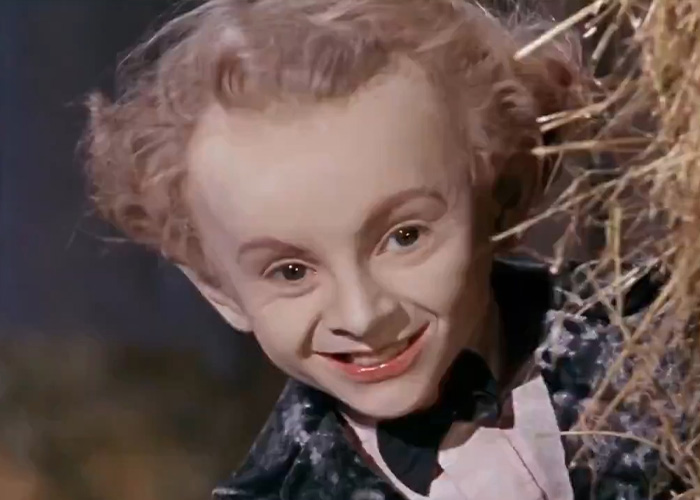 Creepy Rumpelstiltskin Tiptoe man smiling behind dry straw Creepy Rumpelstiltskin Tiptoe man smiling behind dry straw