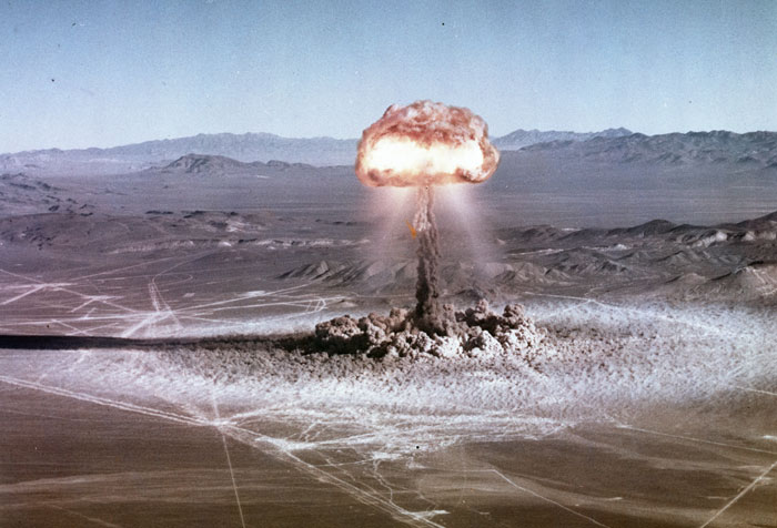 Nuclear explosion mushroom cloud depicting existential risk from health threats