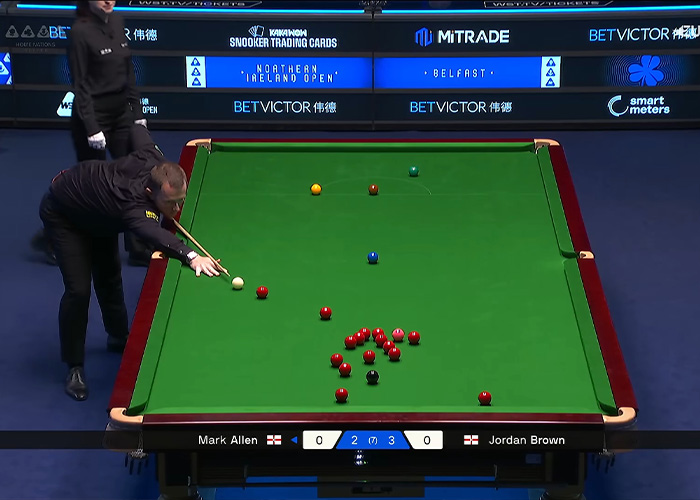 Snooker player lining up a shot at Northern Ireland Open match.
