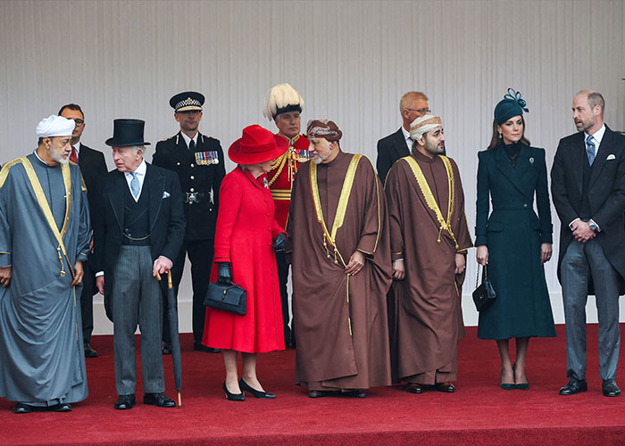 Royal family members including Kate and Prince William standing together at a formal royal event