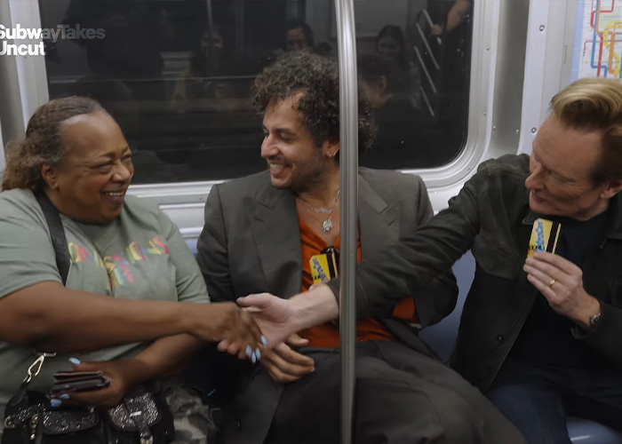 A bar owner shakes hands during a subway interview with Conan O'Brien. A bar owner shakes hands during a subway interview with Conan O'Brien.