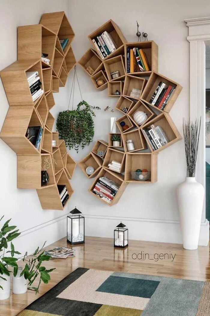 Unique geometric honeycomb shelving on a corner wall highlighting clever wooden creations