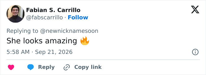 A user post complimenting Christina Aguilera's bold fashion look with a fire emoji.