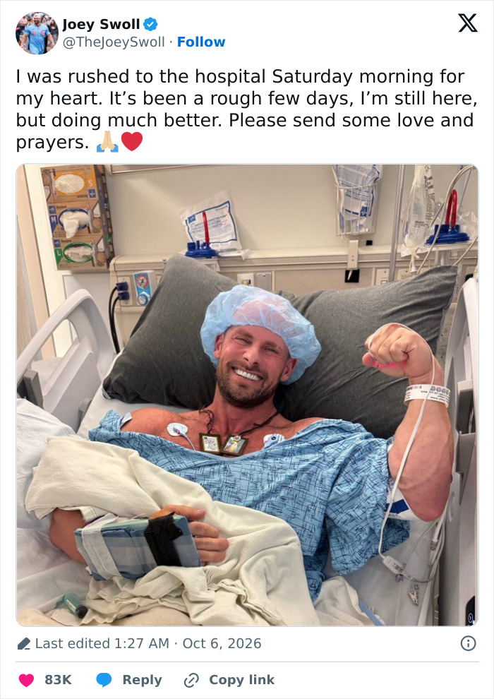 Joey Swoll in a hospital bed smiling and flexing his arm after heart surgery Joey Swoll in a hospital bed smiling and flexing his arm after heart surgery