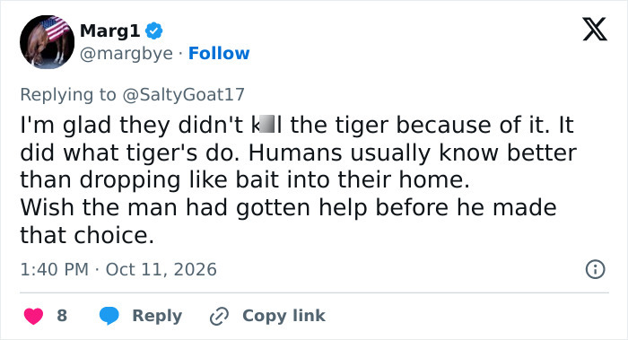 Social media comment discussing a man entering a tiger enclosure and the animal's natural behavior.