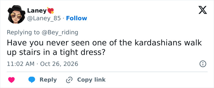 Online reply comparing Nicki Minaj's unusual walk at a Trump rally to wearing a tight dress on stairs. Online reply comparing Nicki Minaj's unusual walk at a Trump rally to wearing a tight dress on stairs.