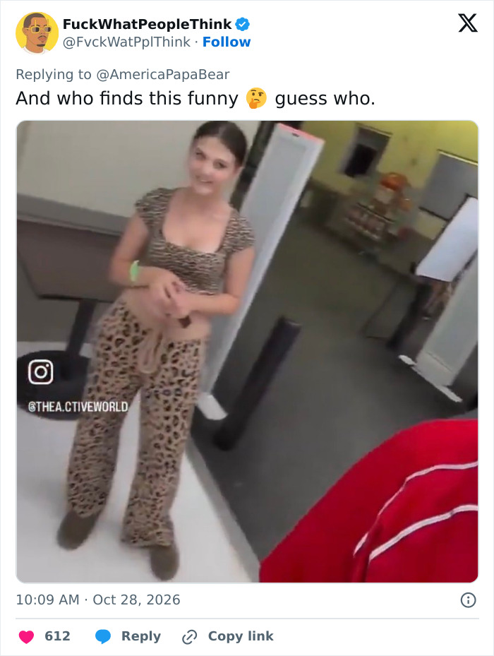 A young woman in leopard print posing for an Instagram prankster video in a store near a store employee. A young woman in leopard print posing for an Instagram prankster video in a store near a store employee.