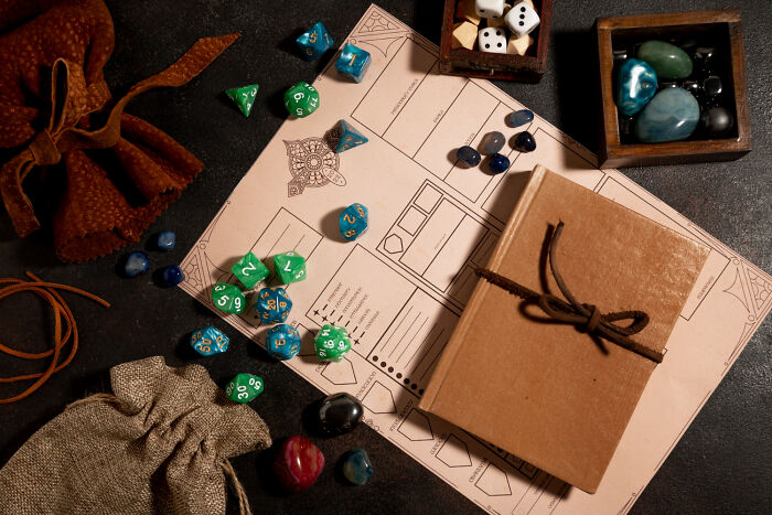 Tabletop role-playing game setup with dice and character sheet, highlighting obvious lies in gaming.
