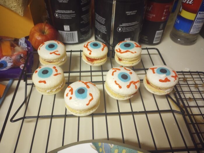 Eyeball macarons resting on a rack as Halloween foods.