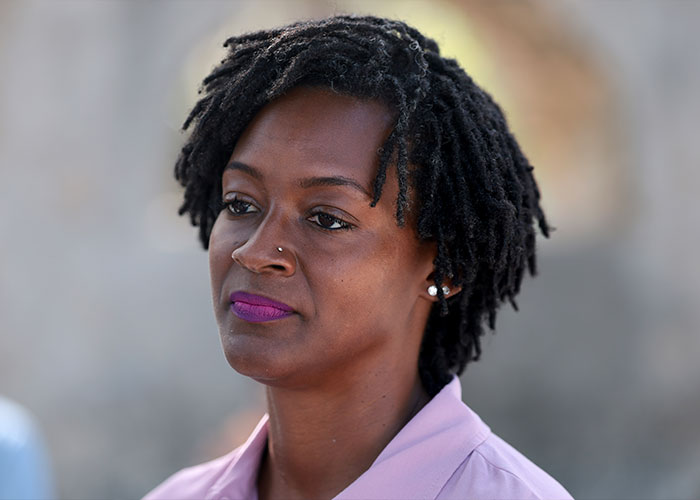 Close-up portrait of Black lawmaker Amara Enyia looking thoughtful. Close-up portrait of Black lawmaker Amara Enyia looking thoughtful.