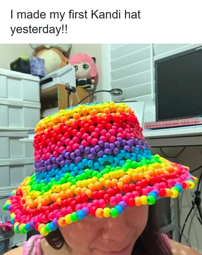 A person wearing a colorful rainbow beaded bucket hat, demonstrating unique crafts and art projects
