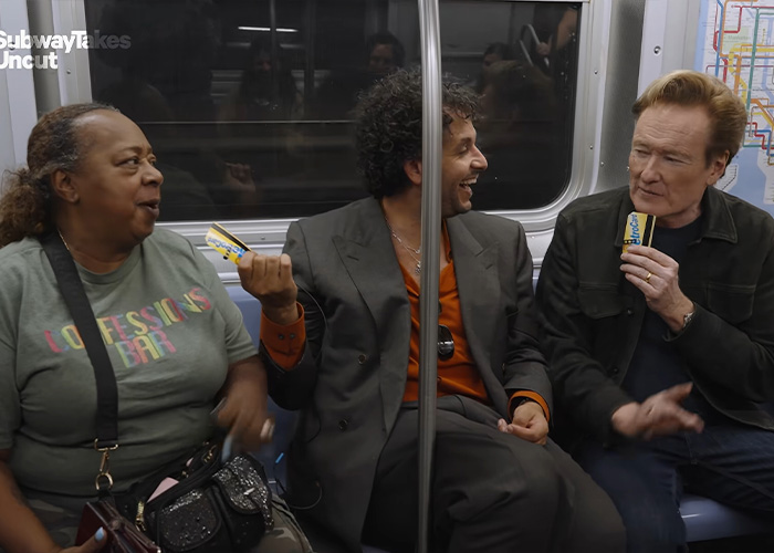 A bar owner sitting with Conan O'Brien during a subway interview. A bar owner sitting with Conan O'Brien during a subway interview.