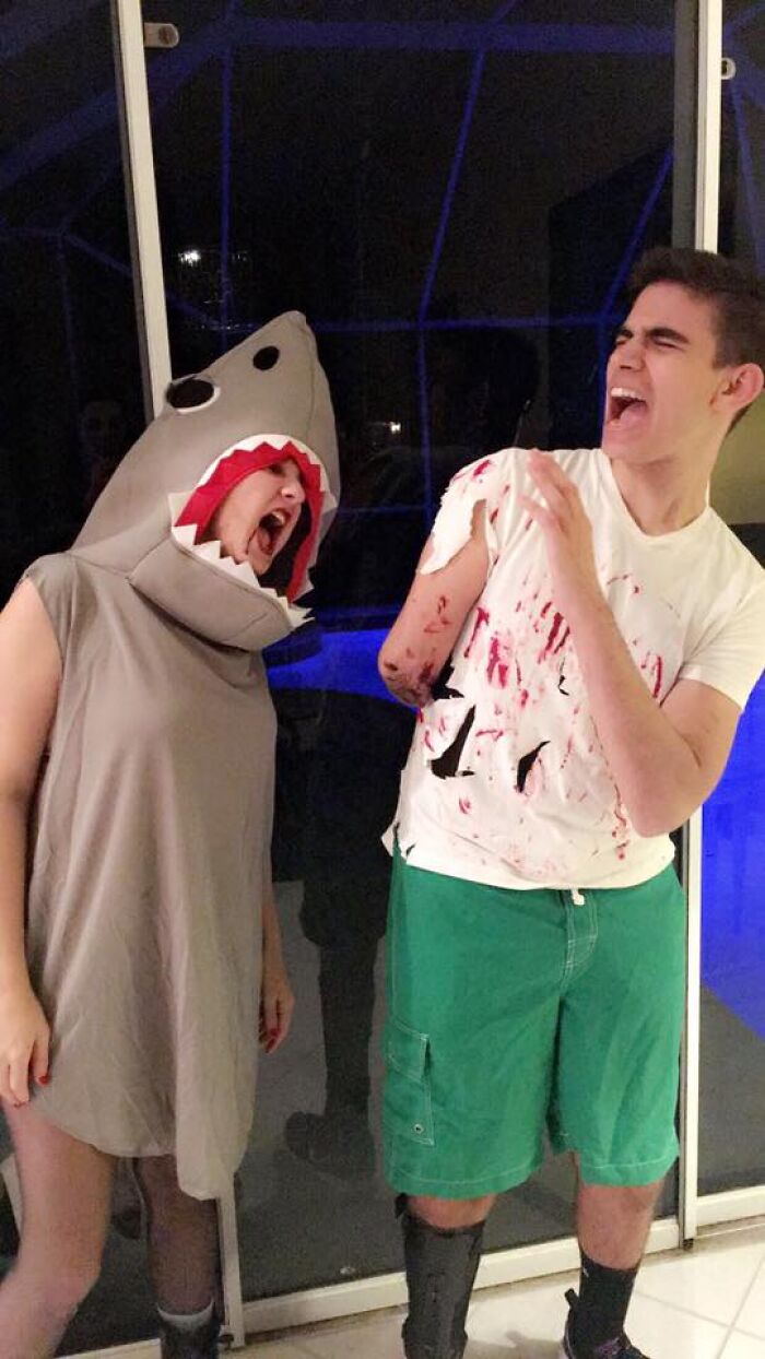 Funny Halloween costume featuring a shark attack scene with an amputee man.