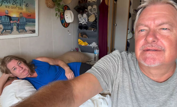 A couple inside their room on a permanent cruise ship A couple inside their room on a permanent cruise ship