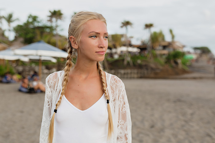 A blonde woman looking away, representing the sister who chose to walk away from her mom and sister. A blonde woman looking away, representing the sister who chose to walk away from her mom and sister.