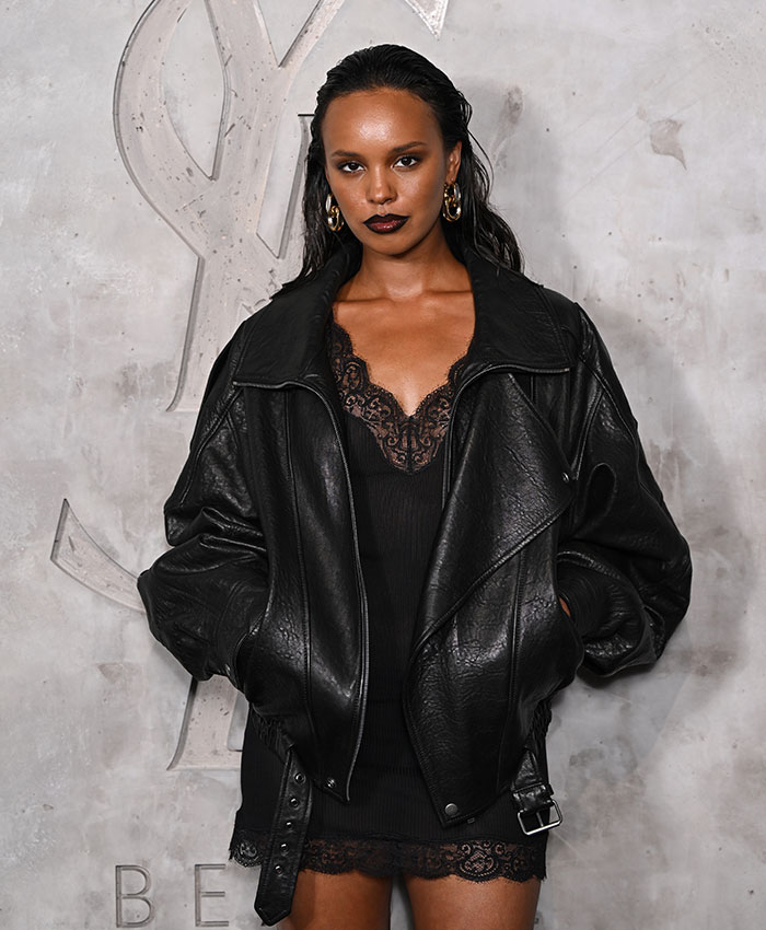 Hollywood actress Alisha Boe wearing a black leather jacket and lace-trimmed dress