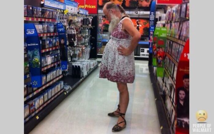 Bearded man in floral dress shopping in Walmart aisle