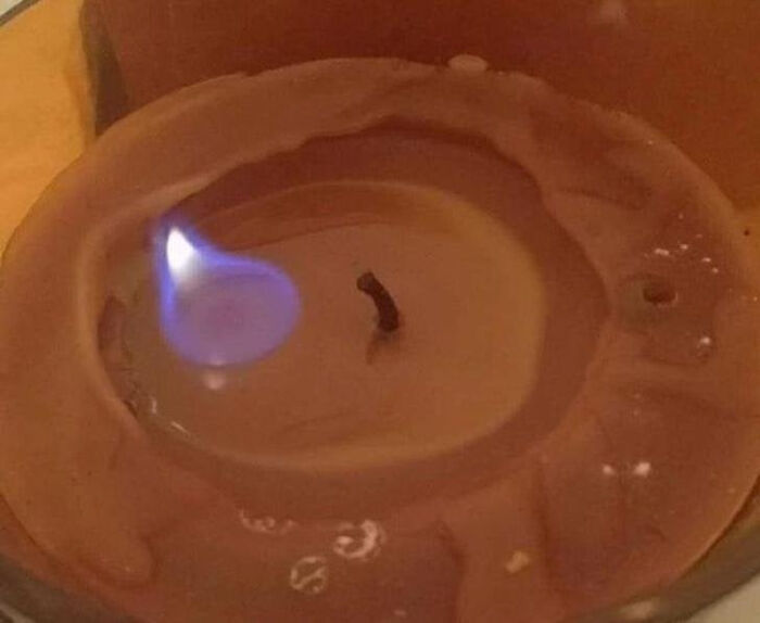 Blue flame glitch on melted candle wax fire showing matrix glitch