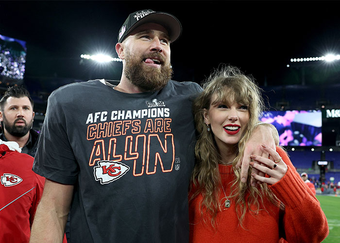 Taylor Swift hugging Travis Kelce after the Chiefs game