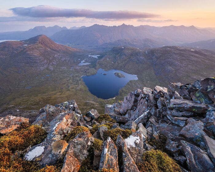 Scenic mountain view over a tranquil lake featured in natural landscape photography.