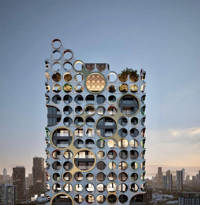 Unique modern building featuring circular openings in facade