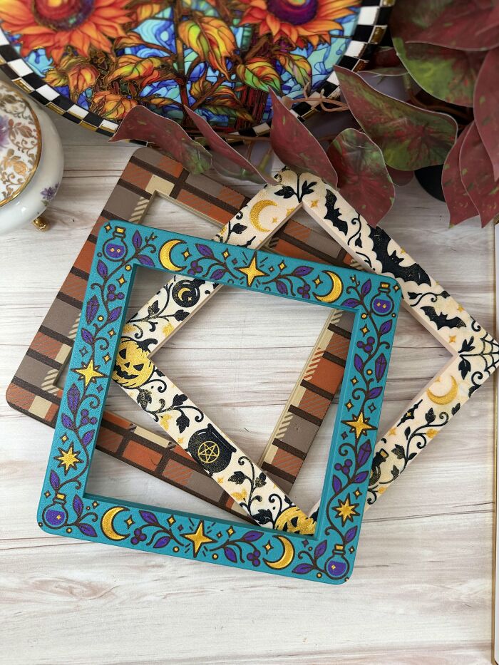 Decorative square picture frames with Halloween themed designs crafted using 3D prints