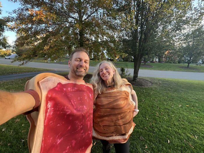 A couple wearing peanut butter and jelly toast outfits for low-effort Halloween costumes outdoors.