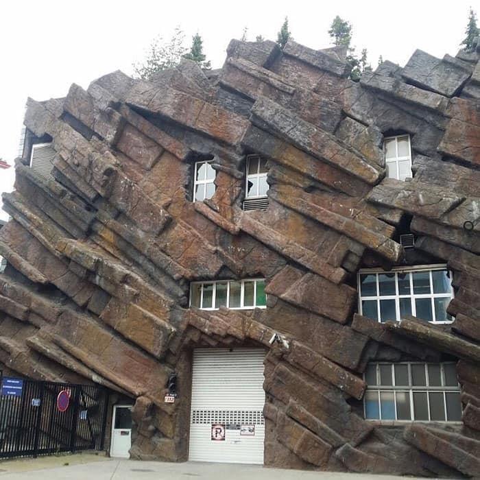 Building with rock-like facade and irregular stone patterns architectural design