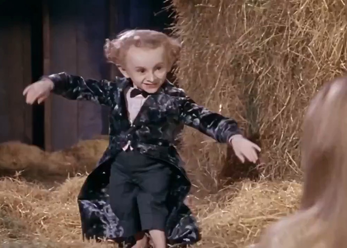 The Rumpelstiltskin Tiptoe man performing his signature sneaky tiptoe dance on hay. The Rumpelstiltskin Tiptoe man performing his signature sneaky tiptoe dance on hay.