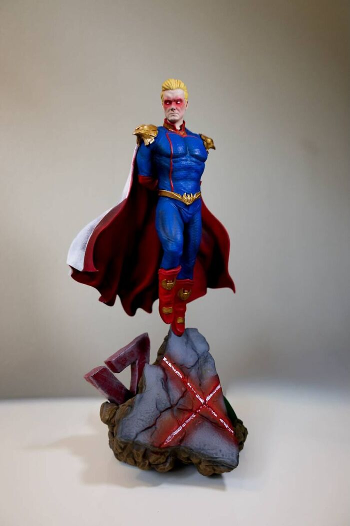 A detailed Homelander action figure sculpture created using colorful 3D prints