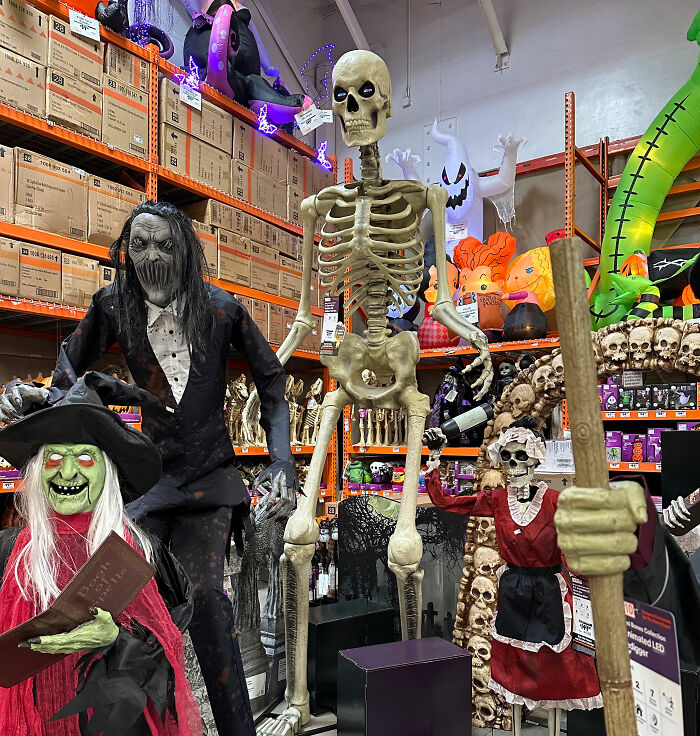 Large Halloween skeleton and other spooky decorations in store display Large Halloween skeleton and other spooky decorations in store display