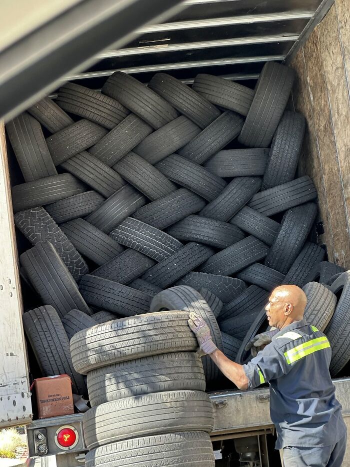 Interesting and cool pics of a truck meticulously packed with tires in a braided pattern