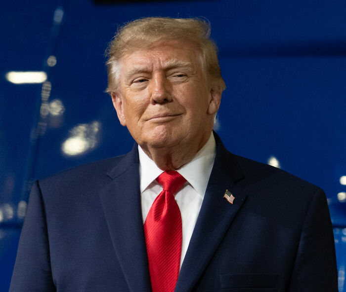 Expert Weighs In After Trump's Odd Stance In Viral Video Leads To Speculation