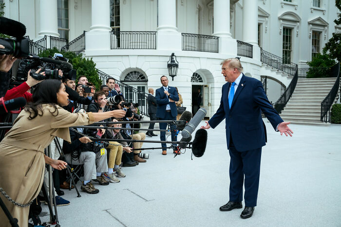 Expert Weighs In After Trump's Odd Stance In Viral Video Leads To Speculation