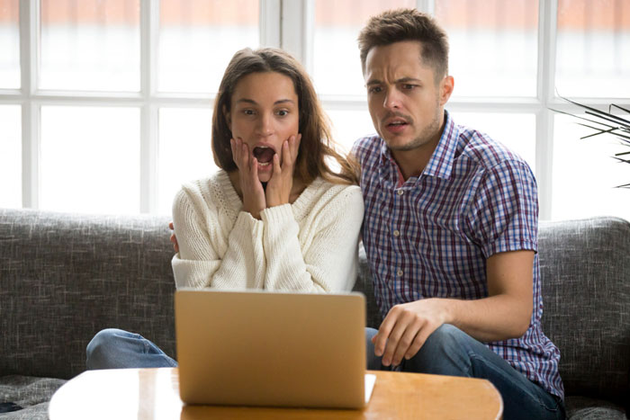 Couple shocked by wedding expenses on laptop