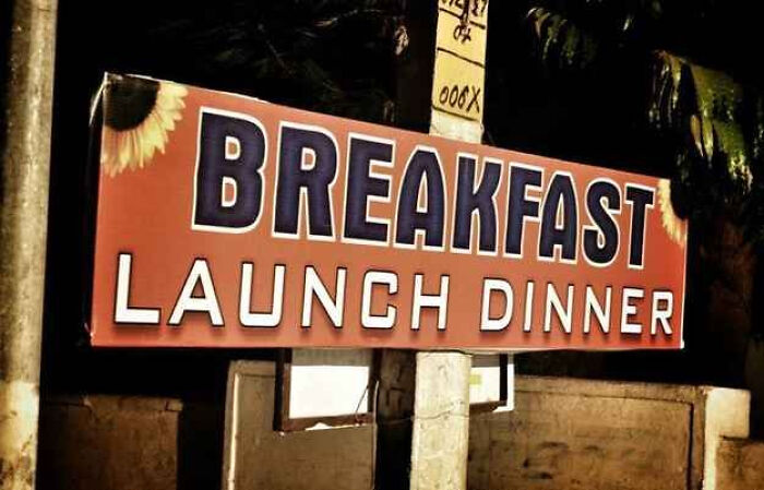 A restaurant sign displaying translation fails with launch instead of lunch written in big letters.