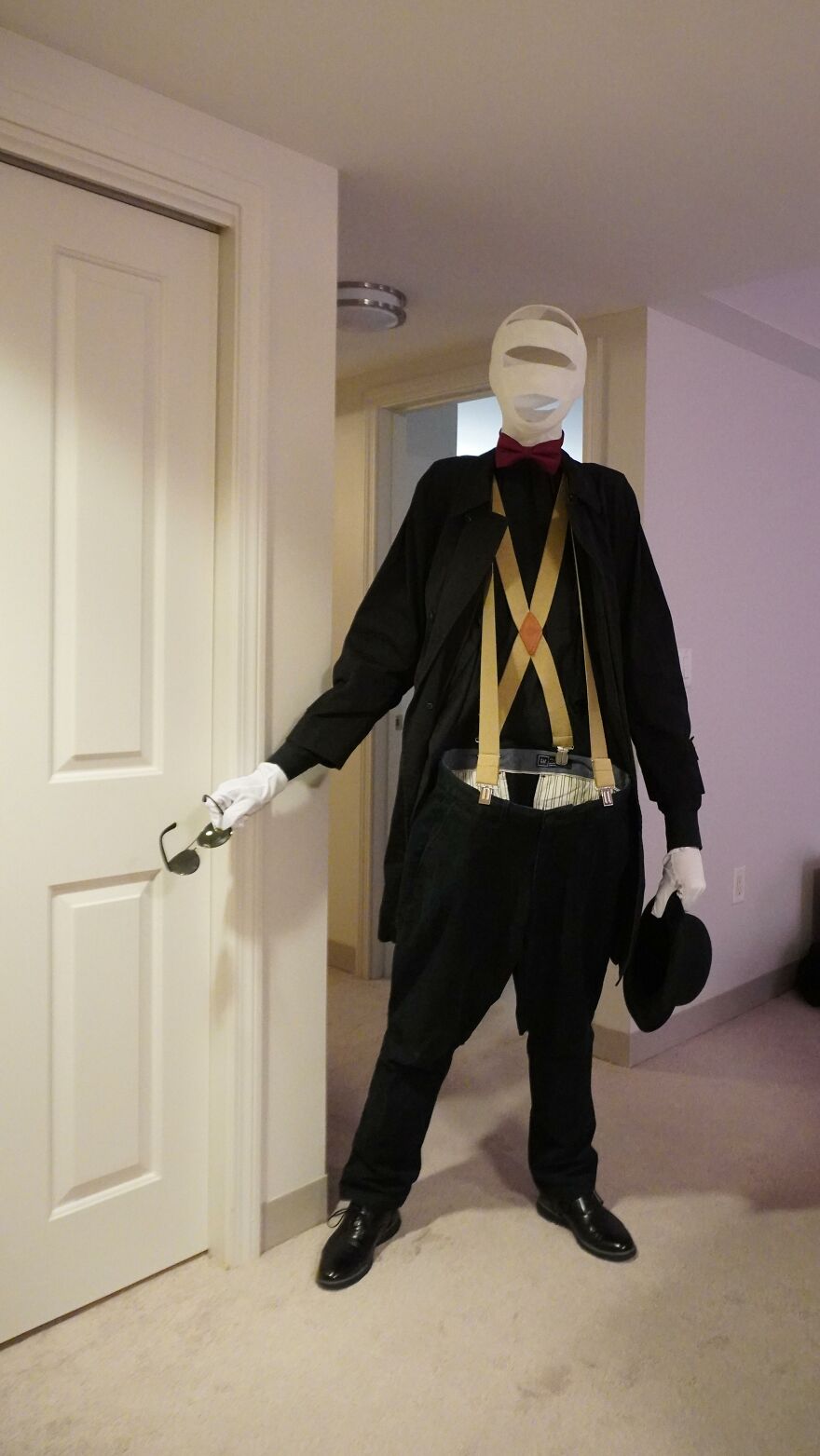 An invisible man costume with bandages and suspenders representing creative Halloween costume ideas.