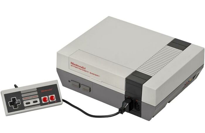 Original Nintendo Entertainment System NES console and controller, iconic nostalgic item for '80s kids.