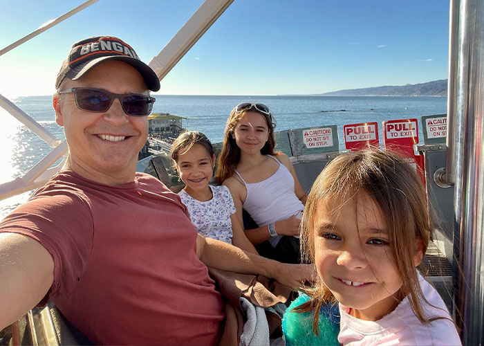 Chad Lowe with daughters enjoying outdoor ride by the ocean
