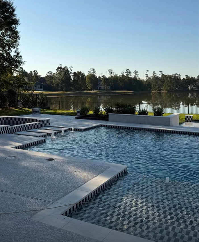 Swimming pool and lake view at the 1.2M Texas home sold by Simone Biles and husband Jonathan Owens.