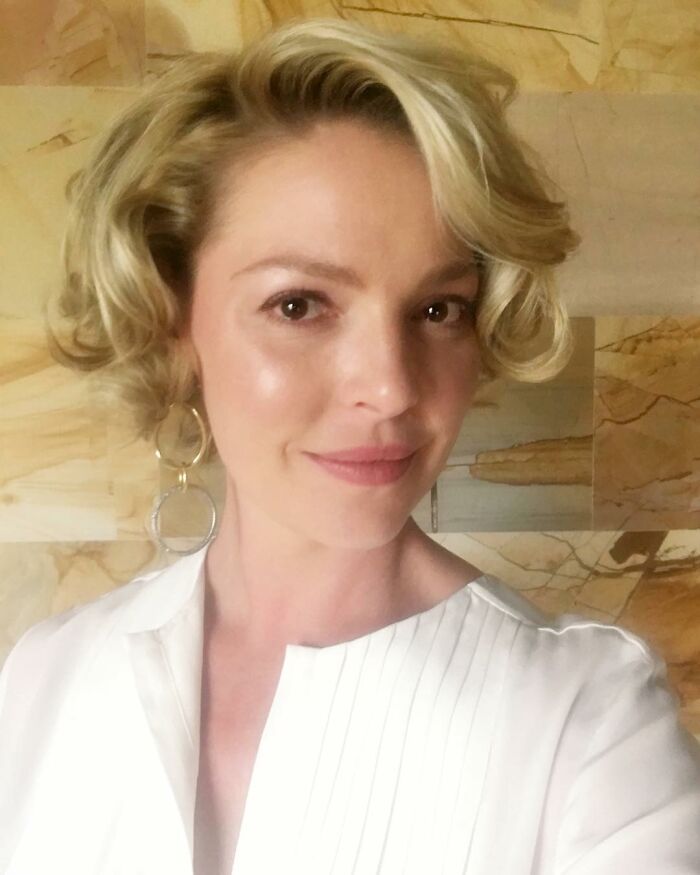 Katherine Heigl smiling at the camera, representing stars who got in the way of their own success.