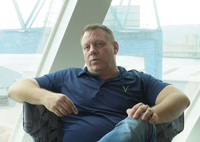 Founder of permanent cruise seated during an interview setting Founder of permanent cruise seated during an interview setting