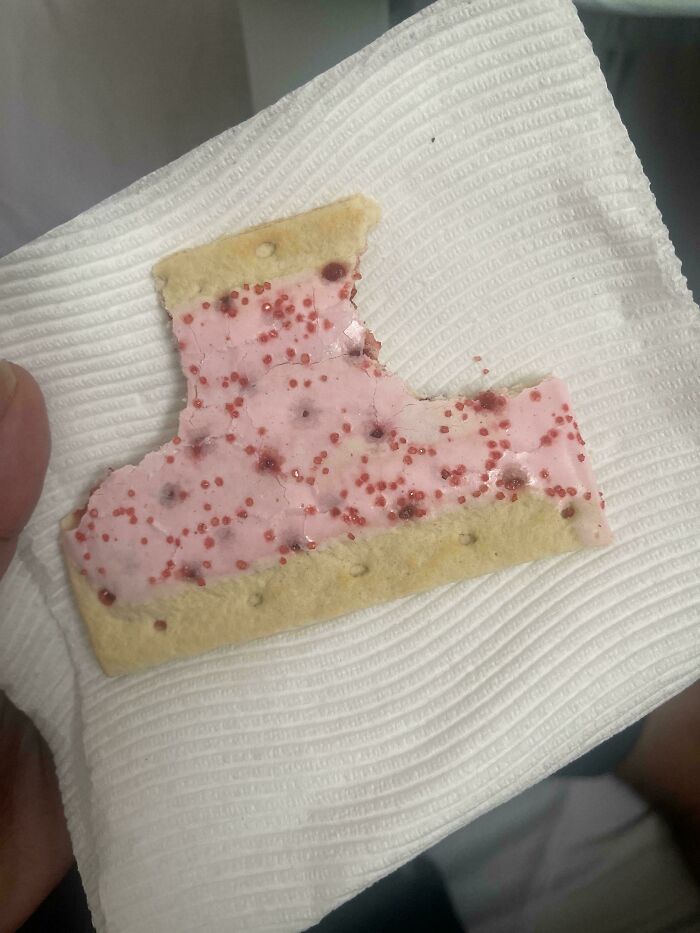 A partially eaten Pop-Tart showing a husband's funniest quirks of eating around the edges
