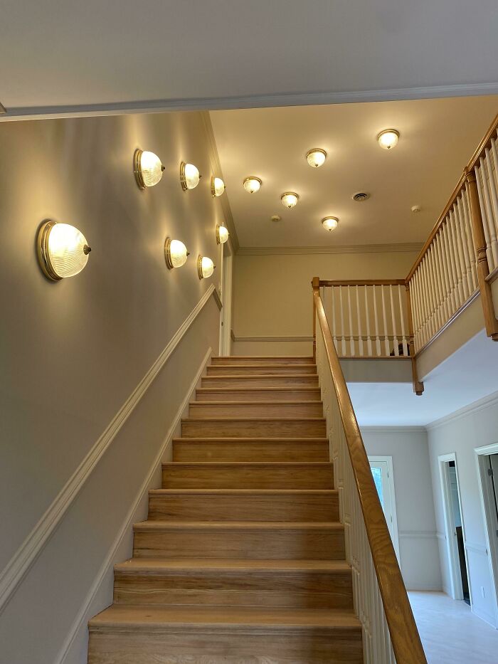 An excessive number of wall and ceiling lights installed as DIY projects.