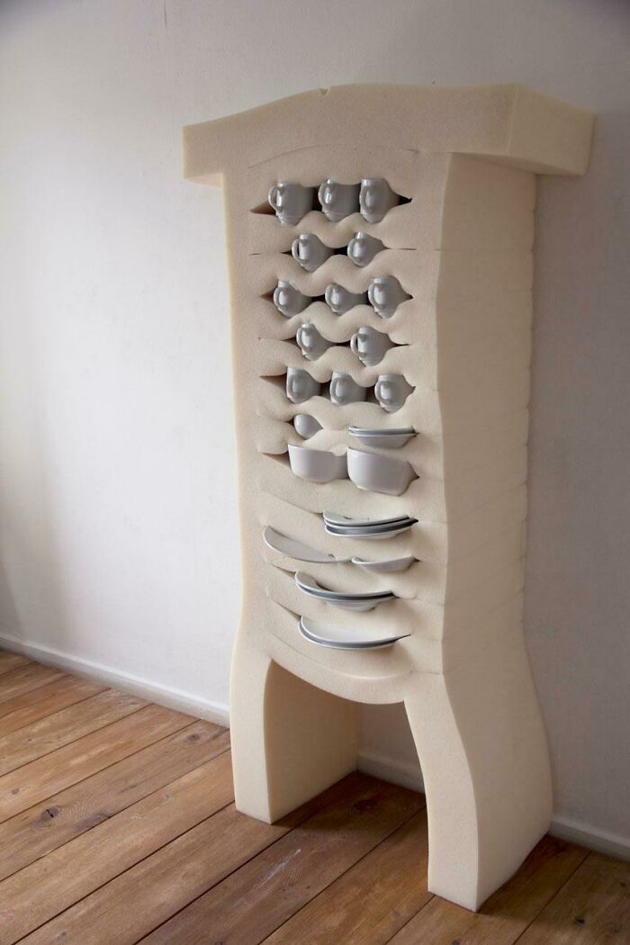 An unconventional foam storage cabinet holding cups and plates, an example of creative DIY projects.
