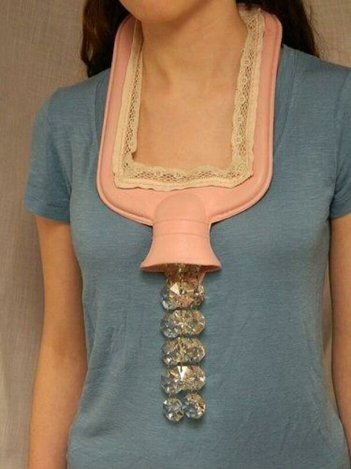 A woman wearing a pink hot water bottle as a necklace for creative DIY projects