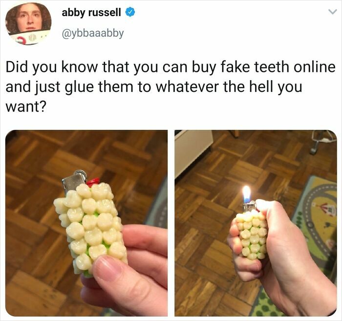 A hand holding a lighter decorated with creepy fake teeth, showing odd DIY projects.